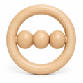 Natural maple ring rattle with three wooden beads on a crossbar, on white