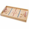 Natural maple tabletop hockey rink with red and blue lines, two goals, pucks and flick sticks on white
