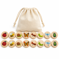 Sixteen round wooden garden bug memory discs in two rows beside a muslin drawstring bag, on white