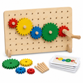 Birch pegboard with a chain of red, yellow, blue and green wooden gears and a hand crank, with challenge cards, on white