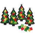 Four pine-tree-shaped cardstock suncatchers with green, gold and red tissue paper taped to a sunny window