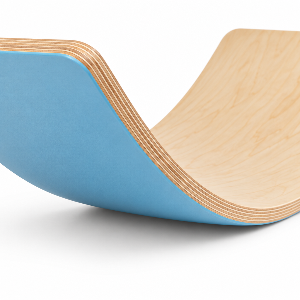 Close-up of the layered plywood edge and smooth sanded curve of the rocker